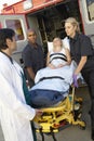 Paramedic preparing to unload patient Royalty Free Stock Photo