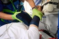 Paramedic puts special cuff on patient to measure blood pressure