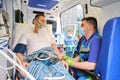 Paramedic records patient responses in ambulance Royalty Free Stock Photo