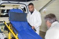 paramedic team preparing folding bed Royalty Free Stock Photo