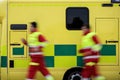 Paramedic team running to ambulance car Royalty Free Stock Photo