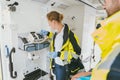 Paramedic using medical technology in ambulance car