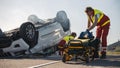 Paramedics and Firefighters Arrive On the Car Crash Traffic Accident Scene. Professionals Prepairi Royalty Free Stock Photo