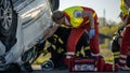 Paramedics and Firefighters Arrive On the Car Crash Traffic Accident Scene. Professionals Rescue I Royalty Free Stock Photo