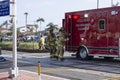 Paramedics getting life saving equipment from ambulance at crash site Royalty Free Stock Photo