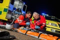 Paramedics giving firstaid to motorbike driver