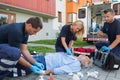 Paramedics giving firstaid to unconscious patient Royalty Free Stock Photo