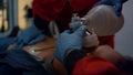 Paramedics hands providing first aid help of man with cardiac respiratory mask