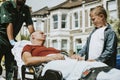 Paramedics moving a patient on a stretcher to an ambulance Royalty Free Stock Photo