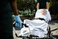 Paramedics moving a young patient on a stretcher to an ambulance Royalty Free Stock Photo