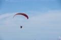 Paramotor flying over the fields in the sky Royalty Free Stock Photo