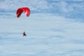 Paramotor flying over the fields in the sky Royalty Free Stock Photo