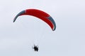 Paramotor pilot flying in a blue sky Royalty Free Stock Photo