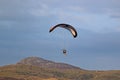 Paramotor pilot flying in the hills of Wales Royalty Free Stock Photo