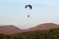 Paramotor pilot landing in the hills of Wales Royalty Free Stock Photo