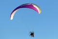 Paramotor pilot flying in a blue sky Royalty Free Stock Photo