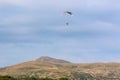 Paramotor pilot flying in the hills of Wales Royalty Free Stock Photo