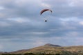 Paramotor pilot flying in the hills of Wales Royalty Free Stock Photo