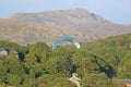 Paramotor pilot landing in the hills of Wales Royalty Free Stock Photo