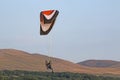 Paramotor pilot landing in the hills of Wales Royalty Free Stock Photo