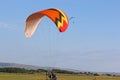 Paramotor pilot taking off from a field Royalty Free Stock Photo
