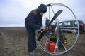 Paramotoring. Man paramotorist preparing paramotor for flight. Kyiv, Ukraine