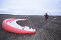 Paramotoring. Paramotorist checking rigging for start to fly