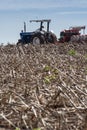 Ford tractor make direct soybean planting in a freshly harvested corn field in the state of