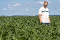 Undefined farmer in corn field