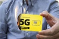 A paranoid man burns a 5g SIM card for fear of harmful radiation. Fighting high-speed Internet 5 g. Retrograde refuses mobile