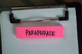 Paraphrase write on sticky notes isolated on Wooden Table Royalty Free Stock Photo