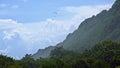 Paraplan over green mountain