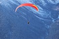 Paraplane flying over snowy Caucasus mountains sunny blue sky