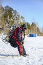 NOVOSIBIRSK, RUSSIA - 28 MARCH, 2020: The paraplane pilot leaning back checks the engine thrust before take off