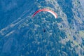 Paraplaners in tandem gliding in blue sky and Alpine mountains on paraplane Royalty Free Stock Photo