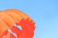 Parasailing, beach umbrella on sky background