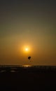 Parasailing extreme sports on beach in sunset background. Royalty Free Stock Photo