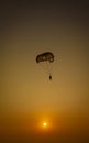 Parasailing extreme sports on beach in sunset background. Royalty Free Stock Photo