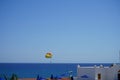 Parasailing in the Mediterranean. Parasailing is a recreational kiting activity where a person is towed behind a vehicle. Rhodes Royalty Free Stock Photo