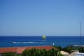 Parasailing in the Mediterranean. Parasailing is a recreational kiting activity where a person is towed behind a vehicle. Rhodes Royalty Free Stock Photo