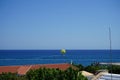 Parasailing in the Mediterranean. Parasailing is a recreational kiting activity where a person is towed behind a vehicle. Rhodes Royalty Free Stock Photo