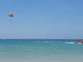 Parasailing over clear blue waters. Different shades of blue in the water Royalty Free Stock Photo