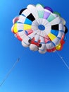 Parasailing parachute against blue sky Royalty Free Stock Photo