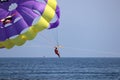 Parasailing on the sea, man flying on parachute Royalty Free Stock Photo