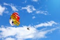 Parasailing - towed parachute against blue sky