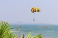 Parasailing on Tropical Beach,shallow DOF, copy space. Girl, teenager under parachute over sea