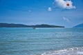 Parasailing on the waves of the azure Andaman sea under the blue sky near the shores of the sandy beautiful exotic and stunning Royalty Free Stock Photo