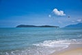 Parasailing on the waves of the azure Andaman sea under the blue sky near the shores of the sandy beautiful exotic and stunning Royalty Free Stock Photo