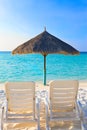 Parasol and chaise lounges Royalty Free Stock Photo