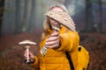 Parasol mushroom in female hand in forest